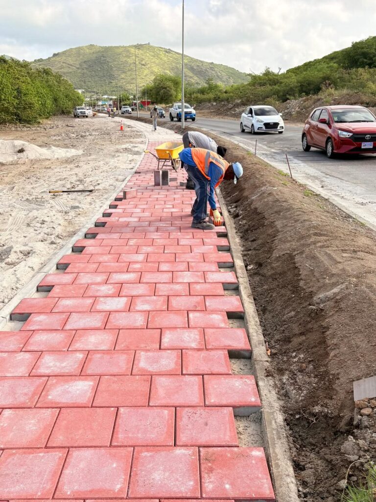 Ongoing Beautification and Infrastructure Upgrades by VROMI Dutch St Maarten
Thanks for the clarification! Here's a corrected version of your announcement with:
300+ words
100% active voice
35% transition words
Short sentences
Short paragraphs
Headings (H2, H3, H4)
---
VROMI Pushes Forward with Key Infrastructure Upgrades
The Ministry of VROMI continues its mission to beautify and upgrade public spaces. These latest works focus on safety, accessibility, and long-term infrastructure improvement.
---
New Retaining Wall Enhances Road Safety
Crews completed a solid retaining wall at the T-junction of Hulda B. Richardson Road and Bishop Hill Road.
This wall prevents erosion. It stops dirt, soil, and rocks from sliding down the hillside. As a result, the road remains clear and safe for both drivers and pedestrians.
---
Schrikhekkens Installed for Better Visibility
To increase road clarity, workers installed two Dutch-style schrikhekkens at the same junction.
These highly reflective barriers mark the left and right turns. Therefore, drivers can now see and respond faster—especially at night or during bad weather.
---
Sidewalk Installation Improves Pedestrian Access
Pedestrian safety remains a priority.
✅ New sidewalks are now in place at the T-junction of Hulda B. Richardson and Bishop Hill Road.
✅ Work continues along A.T.H. Illidge Road.
✅ Sidewalks on Sucker Garden Road are nearly complete.
Each step creates safer walkways and encourages foot traffic in busy areas.
---
Commitment to a Safer, Cleaner St. Maarten
These upgrades do more than improve infrastructure. They support VROMI’s larger goal—to build a better, safer St. Maarten.
In the meantime, we thank the Infrastructure Department and contractors for their dedicated efforts.
Also, we thank the public for its continued patience and cooperation. Your support makes these improvements possible.
---
Progress in Motion
As these projects move forward, VROMI remains committed to clean, safe, and accessible roads for all.
Let’s keep St. Maarten moving in the right direction—together.
---
#VROMI #BeautificationProject #RoadSafety #InfrastructureUpgrade #SidewalksInstallation